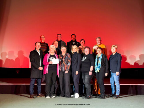 Gruppenaufnahme auf der Scala-Bühne